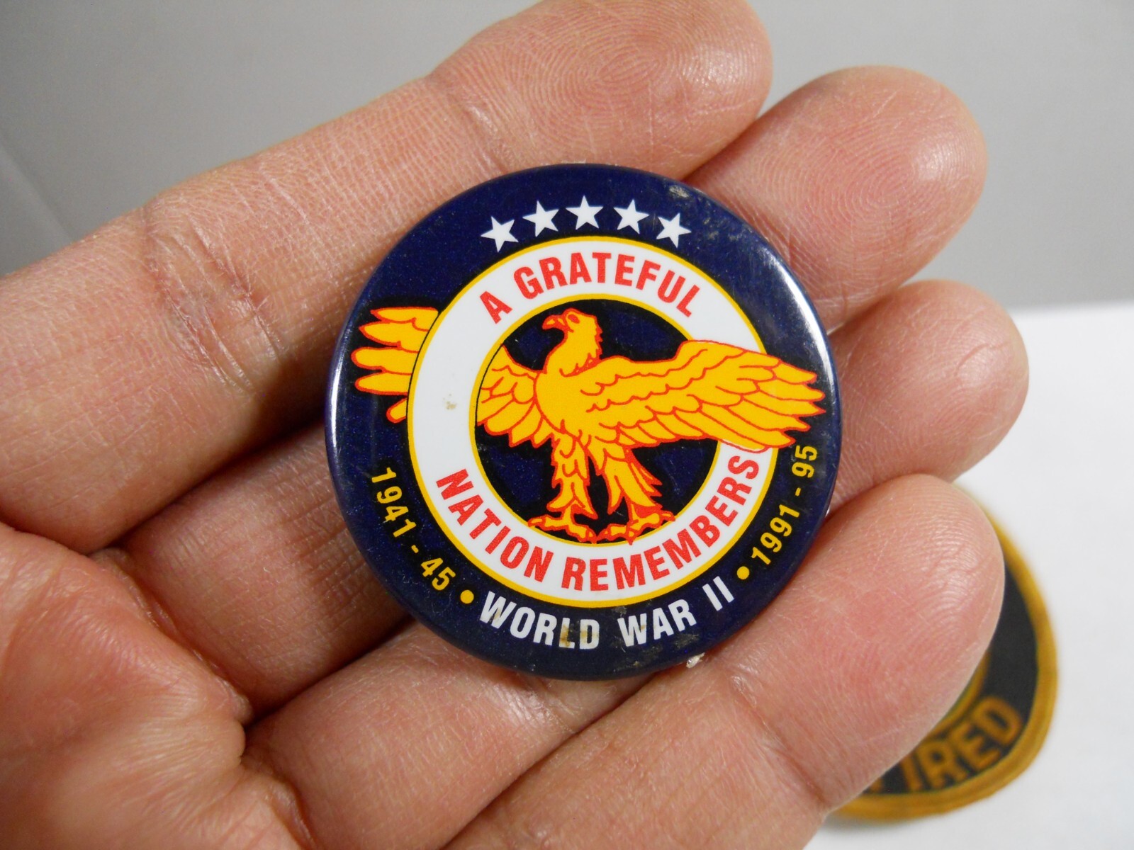 numbered WWII Veteran 50th Anniversary pass badge, pin & Army Retired patch