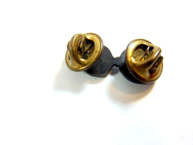 small British military black metal flaming grenade uniform insignia pin