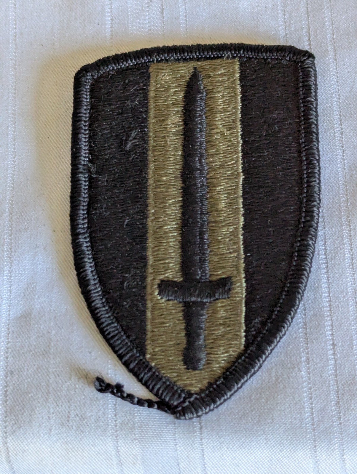 Vietnam era US Army sword embroidered patch subdued 3″ long